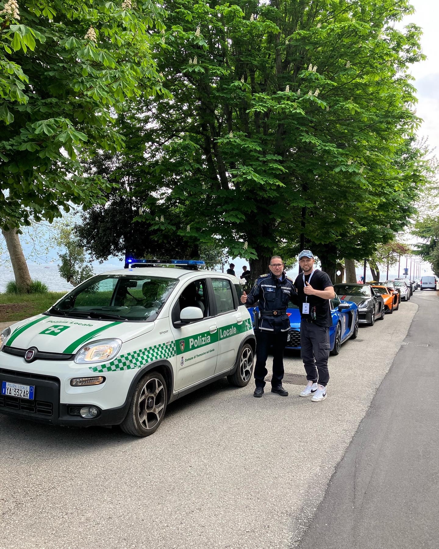 A police escort and LagoRun participants sharing a moment in Italy