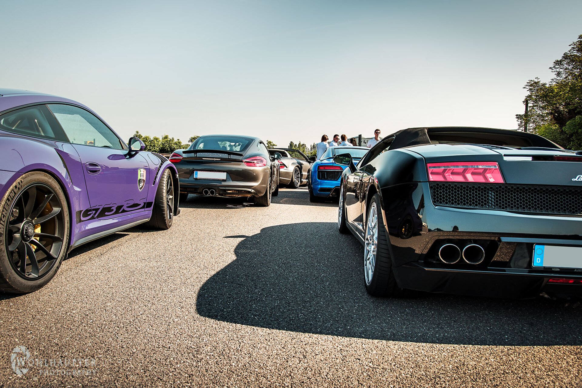 Porsche, Audi and Lamborghini sports cars gathered with LagoRun participants